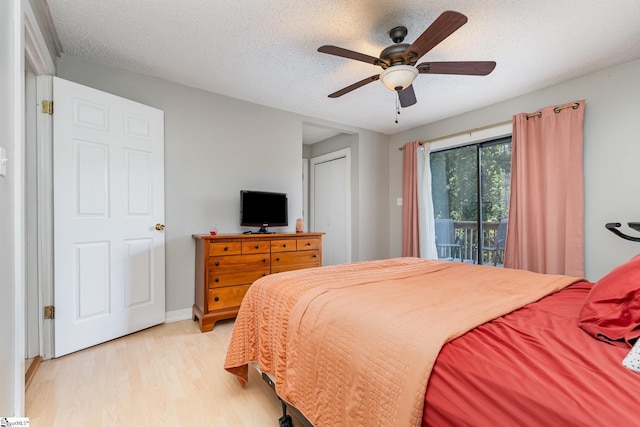2 Line St, Taylors, SC 29687 - bedroom featuring access to exterior, light wood-type flooring, a textured ceiling, and ceiling fan