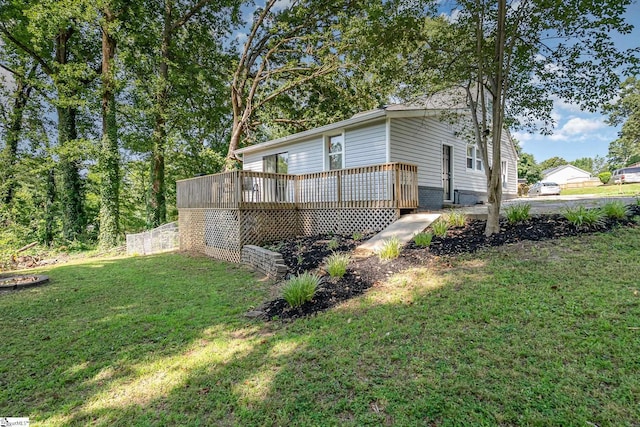2 Line St, Taylors, SC 29687 - view of property exterior featuring a deck and a yard