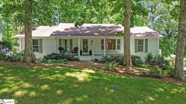 100 Whittlin Way, Taylors, SC 29687 - single story home featuring covered porch, a front yard, and brick siding