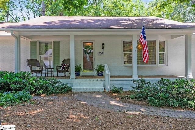 100 Whittlin Way, Taylors, SC 29687 - view of front of property with brick siding, a porch, and a shingled roof
