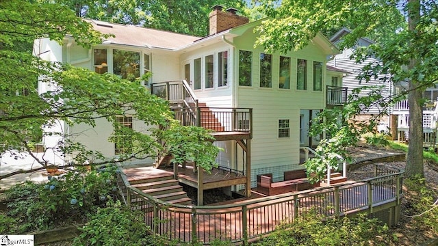 100 Whittlin Way, Taylors, SC 29687 - back of property with a chimney, stairs, and a wooden deck