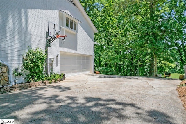 100 Whittlin Way, Taylors, SC 29687 - view of home's exterior with a garage, driveway, and brick siding