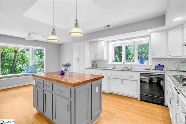 100 Whittlin Way, Taylors, SC 29687 - kitchen with black dishwasher, butcher block counters, gray cabinets, white cabinetry, and decorative backsplash
