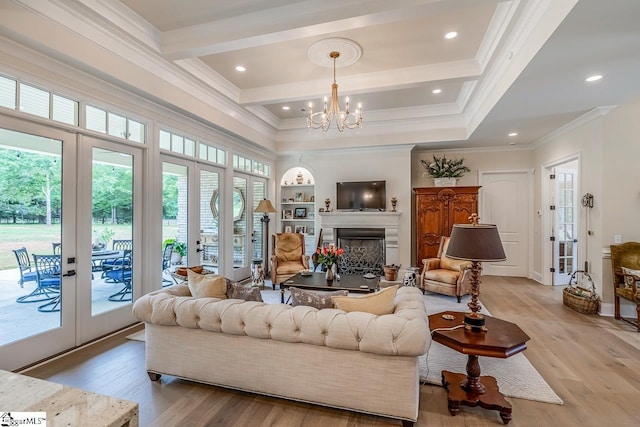 2765 Brockman Mcclimon Rd, Greer, SC 29651 - living area with crown molding, light wood-type flooring, french doors, a chandelier, and a fireplace