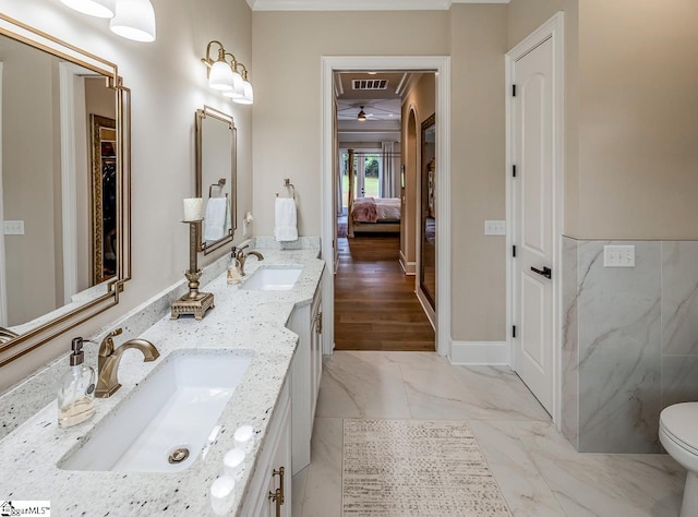 2765 Brockman Mcclimon Rd, Greer, SC 29651 - ensuite bathroom featuring double vanity, ceiling fan, and marble look tile flooring