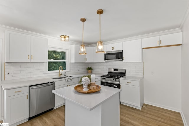 103 Gaithburg Sq, Taylors, SC 29687 - kitchen with appliances with stainless steel finishes, white cabinets, light countertops, tasteful backsplash, and crown molding