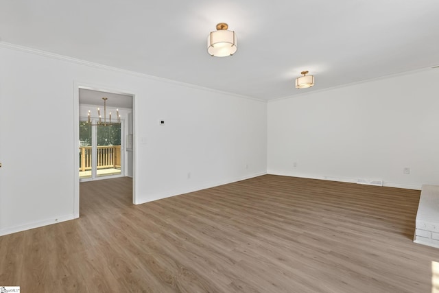 103 Gaithburg Sq, Taylors, SC 29687 - empty room featuring ornamental molding, light wood-style floors, and a chandelier