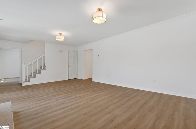 103 Gaithburg Sq, Taylors, SC 29687 - unfurnished living room featuring light wood finished floors, stairway, and ornamental molding