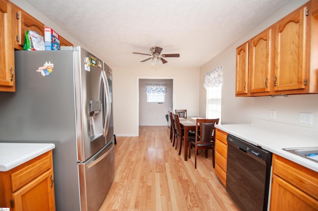 262 Bagwell Dr, Pauline, SC 29374 - kitchen featuring stainless steel refrigerator with ice dispenser, black dishwasher, light countertops, light wood-style floors, and ceiling fan