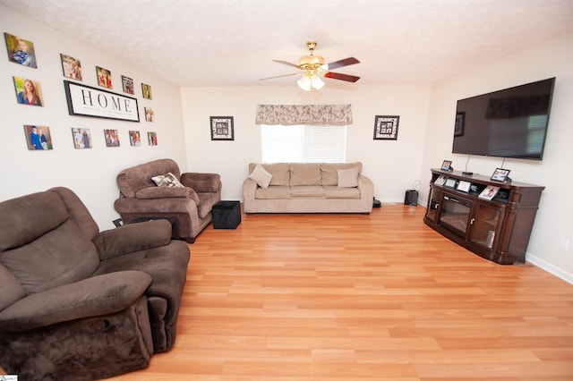 262 Bagwell Dr, Pauline, SC 29374 - living area with ceiling fan, light wood-style flooring, and a textured ceiling