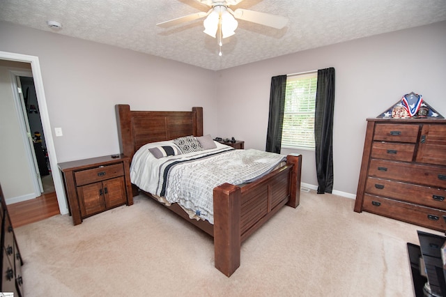 262 Bagwell Dr, Pauline, SC 29374 - bedroom featuring light colored carpet, a textured ceiling, and a ceiling fan