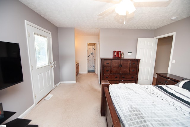 262 Bagwell Dr, Pauline, SC 29374 - bedroom with light carpet, a textured ceiling, ceiling fan, and connected bathroom
