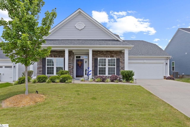 506 Bellot Winds Dr, Duncan, SC 29334 - view of front of home with a garage, concrete driveway, a front yard, stone siding, and a shingled roof