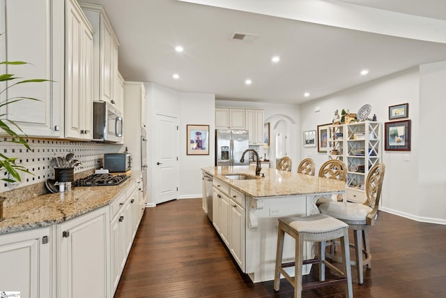 506 Bellot Winds Dr, Duncan, SC 29334 - kitchen with stainless steel appliances, a kitchen bar, tasteful backsplash, dark wood-style flooring, and recessed lighting