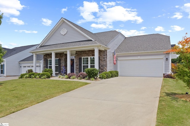 506 Bellot Winds Dr, Duncan, SC 29334 - view of front of property featuring an attached garage, a front lawn, concrete driveway, stone siding, and a shingled roof