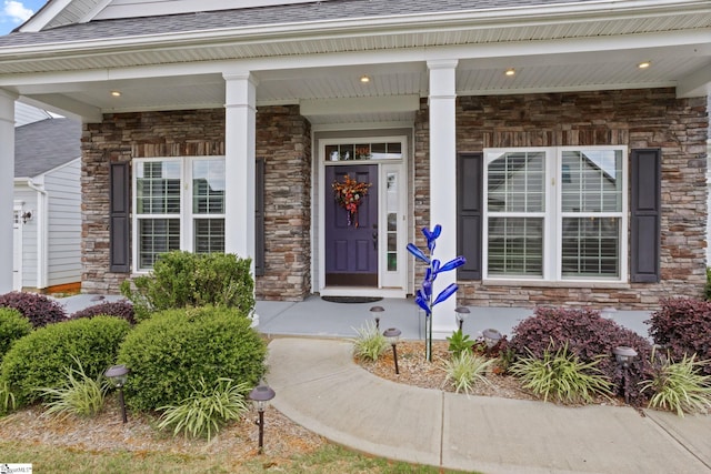 506 Bellot Winds Dr, Duncan, SC 29334 - entrance to property featuring stone siding, a porch, and roof with shingles
