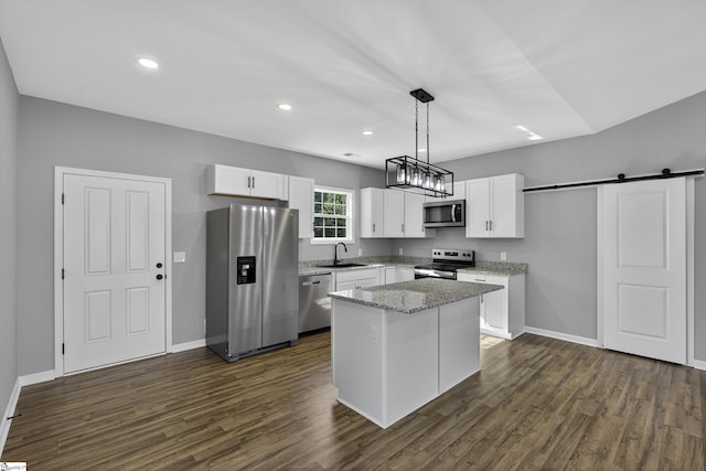 107 Toney Creek Rd, Belton, SC 29627 - kitchen with stainless steel appliances, white cabinets, a barn door, dark wood-style floors, and recessed lighting