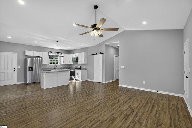 107 Toney Creek Rd, Belton, SC 29627 - kitchen featuring appliances with stainless steel finishes, open floor plan, a kitchen island, white cabinets, and dark wood-style flooring