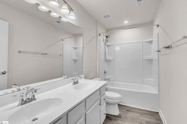 10 Wiltshire Cir, Easley, SC 29642 - full bathroom featuring wood finished floors, double vanity, and washtub / shower combination