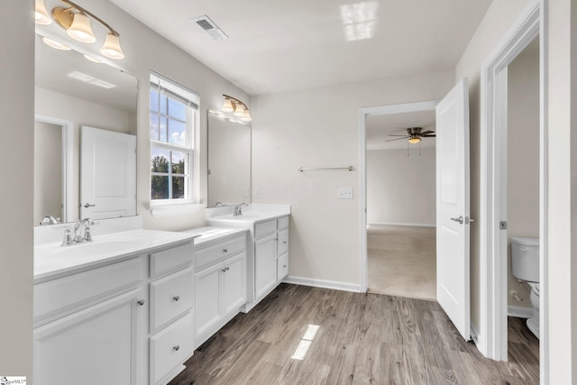 10 Wiltshire Cir, Easley, SC 29642 - bathroom featuring double vanity, ceiling fan, and wood finished floors