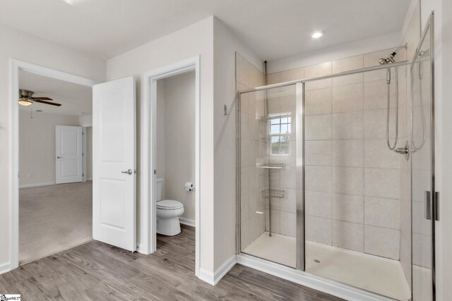10 Wiltshire Cir, Easley, SC 29642 - bathroom featuring a shower stall, wood finished floors, and ceiling fan