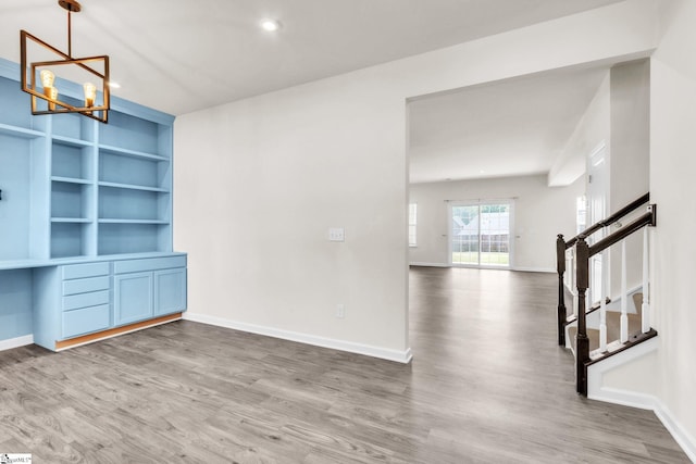10 Wiltshire Cir, Easley, SC 29642 - unfurnished dining area featuring a chandelier, wood finished floors, stairs, built in features, and recessed lighting