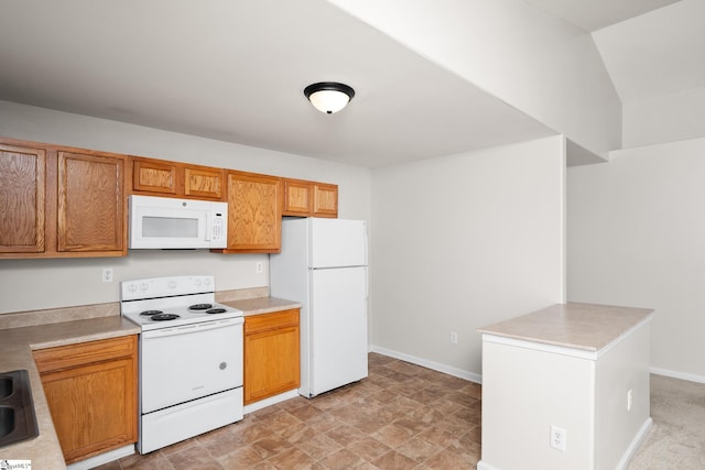 196 Reedy Fork Rd, Greenville, SC 29605 - kitchen with white appliances, light countertops, and brown cabinetry