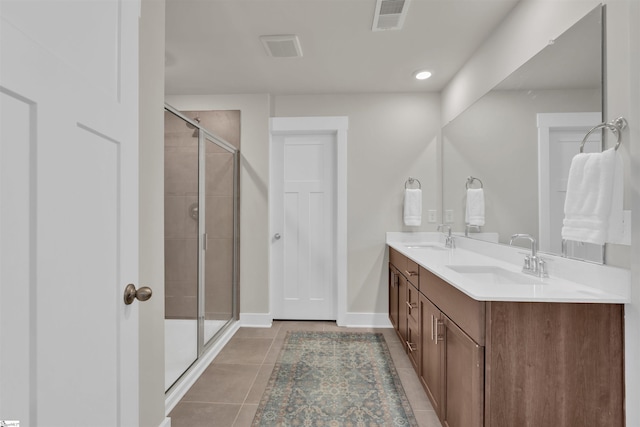 6 Shorncliffe Rd, Simpsonville, SC 29680 - bathroom with double vanity, a stall shower, tile patterned floors, and recessed lighting