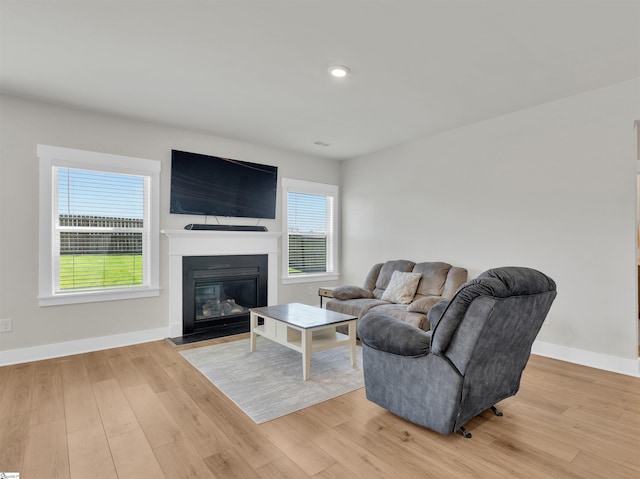6 Shorncliffe Rd, Simpsonville, SC 29680 - living room featuring light wood-type flooring, a fireplace with flush hearth, and recessed lighting