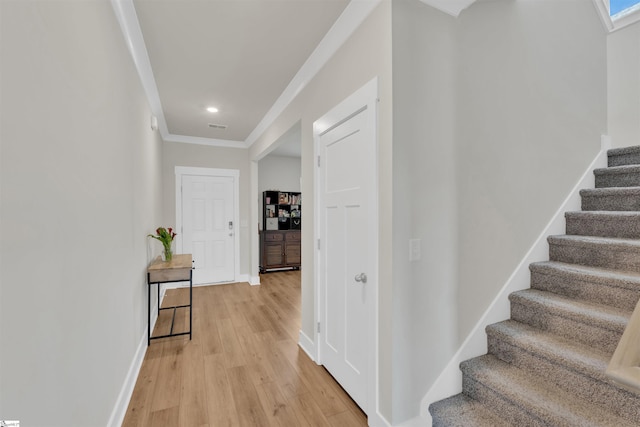 6 Shorncliffe Rd, Simpsonville, SC 29680 - corridor with stairway, ornamental molding, light wood-style flooring, and recessed lighting