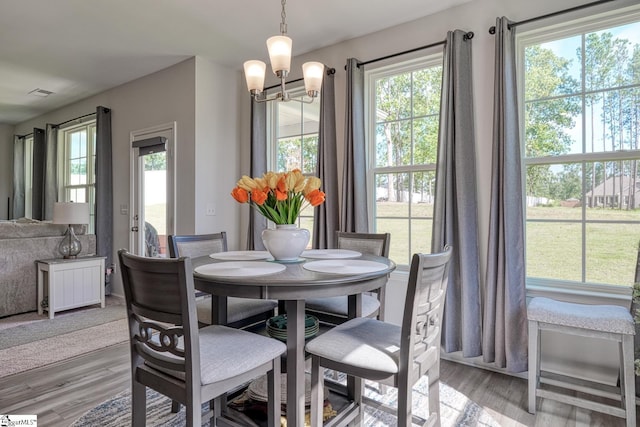 4002 Hometown Way, Boiling Springs, SC 29316 - dining room with light wood-style flooring and a chandelier