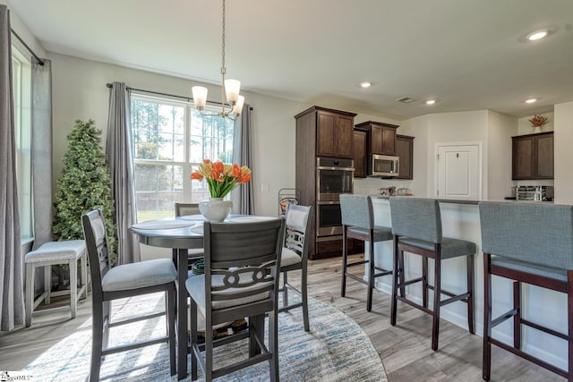 4002 Hometown Way, Boiling Springs, SC 29316 - dining area featuring a chandelier, light wood-style floors, and recessed lighting