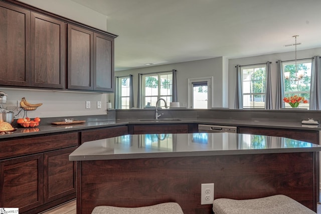 4002 Hometown Way, Boiling Springs, SC 29316 - kitchen featuring dark brown cabinetry, stainless steel dishwasher, a center island, and dark countertops
