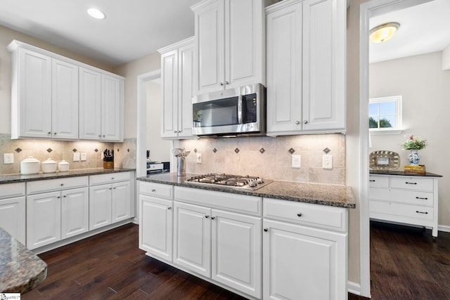 202 Princeton Dr, Duncan, SC 29334 - kitchen featuring appliances with stainless steel finishes, dark wood-type flooring, white cabinets, backsplash, and recessed lighting