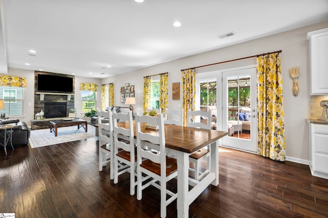 202 Princeton Dr, Duncan, SC 29334 - dining space with dark wood-style floors, a stone fireplace, and recessed lighting