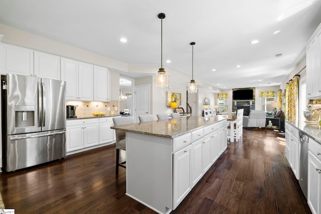 202 Princeton Dr, Duncan, SC 29334 - kitchen with stainless steel appliances, dark wood-style floors, open floor plan, white cabinetry, and recessed lighting