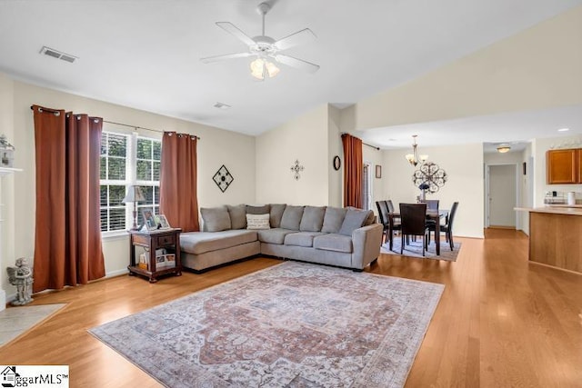431 Lynnell Way, Moore, SC 29369 - living room with a ceiling fan, a chandelier, light wood finished floors, and lofted ceiling
