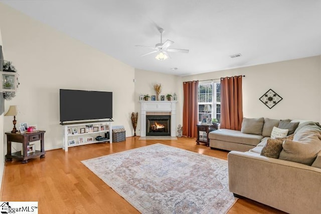 431 Lynnell Way, Moore, SC 29369 - living room with a ceiling fan, light wood-type flooring, and a fireplace with flush hearth