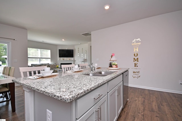 805 Colmore Trl, Lyman, SC 29365 - kitchen with dishwasher, a center island with sink, dark wood-style floors, light stone countertops, and recessed lighting