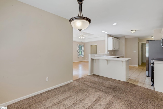 415 N Pond View Dr, Duncan, SC 29334 - kitchen featuring a peninsula, a kitchen breakfast bar, white cabinetry, recessed lighting, and decorative light fixtures