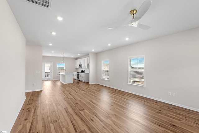 41 Leander Dr, Greer, SC 29651 - unfurnished living room featuring light wood-style flooring, a ceiling fan, and recessed lighting