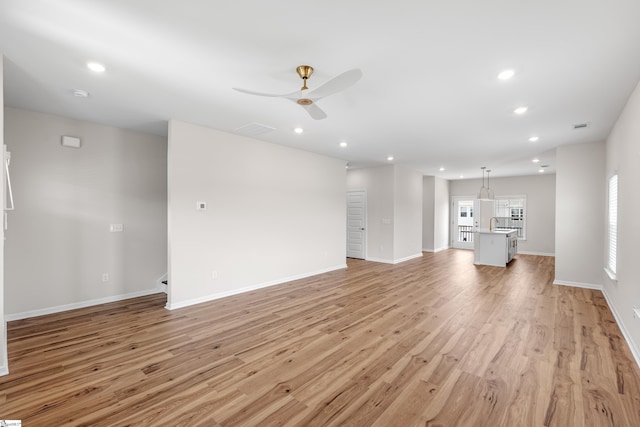 41 Leander Dr, Greer, SC 29651 - unfurnished living room with a ceiling fan, light wood-style flooring, and recessed lighting