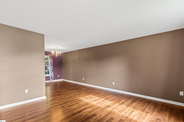 118 Moonshadow Ct, Duncan, SC 29334 - spare room with a chandelier and wood finished floors