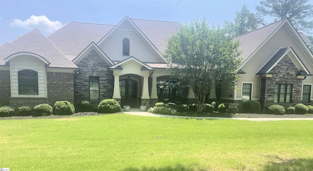 217 Andalusian Trl, Anderson, SC 29621 - craftsman house featuring stone siding, a front lawn, and french doors
