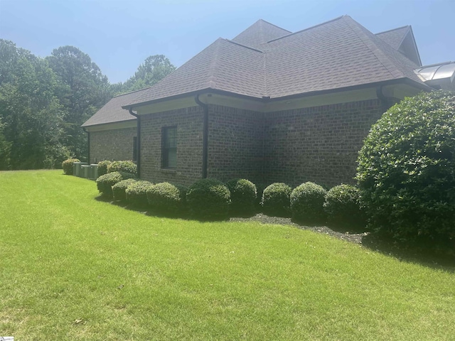 217 Andalusian Trl, Anderson, SC 29621 - view of property exterior featuring brick siding, a lawn, and a shingled roof