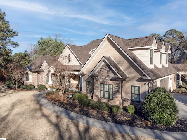 217 Andalusian Trl, Anderson, SC 29621 - view of front of house with an attached garage, stone siding, and driveway