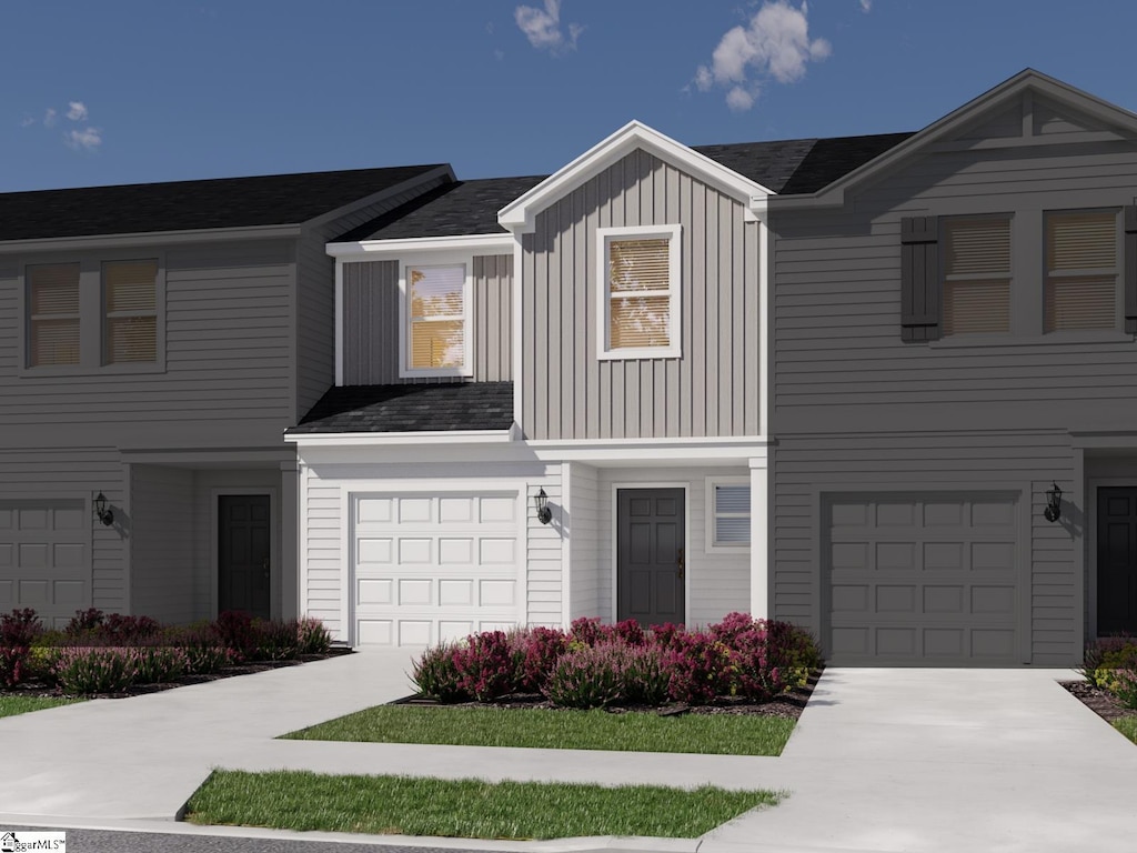845 Ernest Ln, Lyman, SC 29365 - view of front of house featuring an attached garage, driveway, and board and batten siding