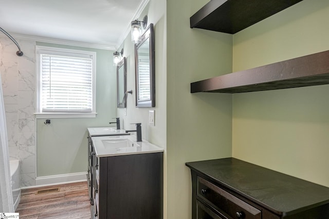 160 Bill Roberson Rd, Enoree, SC 29335 - bathroom featuring double vanity, crown molding, shower / bath combination, and wood finished floors