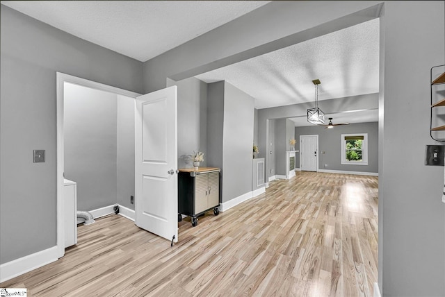 23 Stringer St, Belton, SC 29627 - spare room featuring light wood-type flooring, a textured ceiling, and a ceiling fan