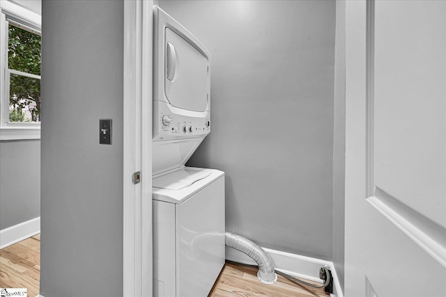 23 Stringer St, Belton, SC 29627 - washroom featuring stacked washing machine and dryer and wood finished floors